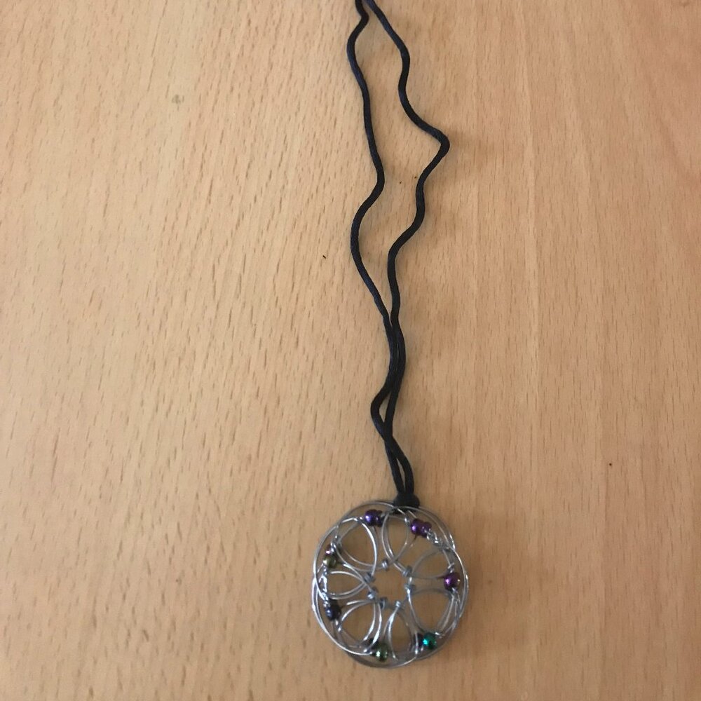 3d geometric pendant necklace on a cord